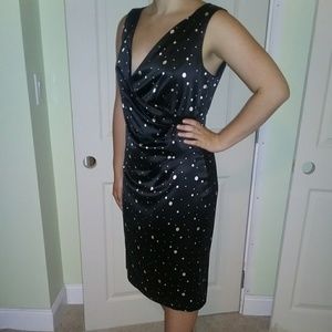 A black with white polka dot midi length dress.